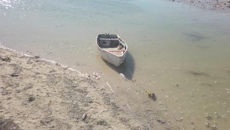 Old-fishing-boat-anchored-on-the-beach