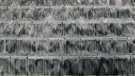 Close-Up-Water-Flowing-Down-of-Tile-Stairs-in-Fountain-on-Palm-Springs