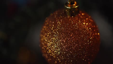 Closeup-of-sparkly-Christmas-ornament-coming-into-focus