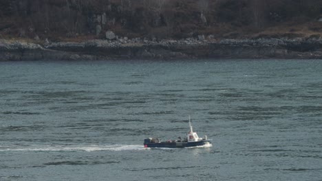 Small-Fishing-Boat-passing-by-from-left-to-right