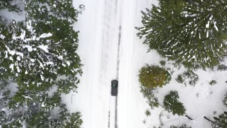 Aerial-view-of-snow-covered-road-in-the-winter