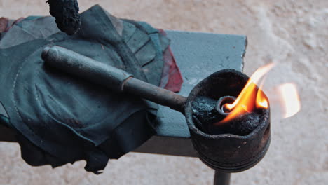 Torch-With-Flame-Used-In-Repairing-Tires-At-Vulcanizing-Shop-In-The-Philippines---closeup-shot