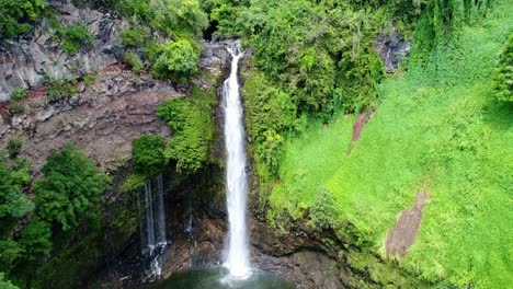 Water-plunges-down-a-river-into-another-pool-in-rainforest---waterfall-base