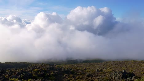 Clouds-engulfing-and-passing-research-station-on-volcano-in-Hawaii