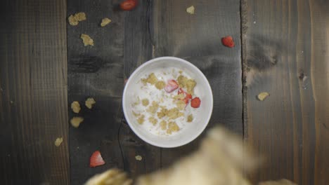 Unique-view-of-cereal-falling-into-a-bowl-of-milk