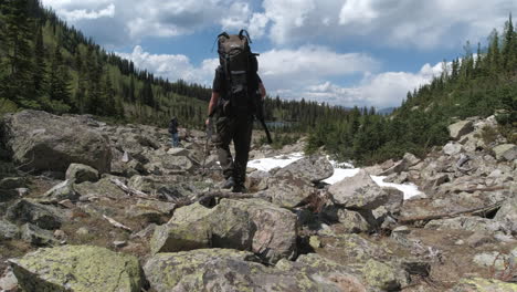 Man-and-Woman-backpacking-in-the-Colorado-mountains
