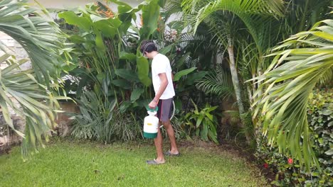 young-man-sanitizing-his-garden