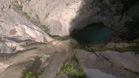 Top-view-drone-shot-of-Dimosari-Waterfall-in-Lefkata