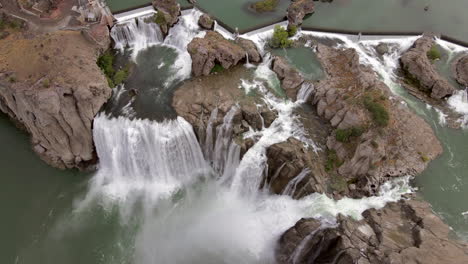 Drone-flying-above-waterfall,-Twin-Falls-waterfall-Idaho
