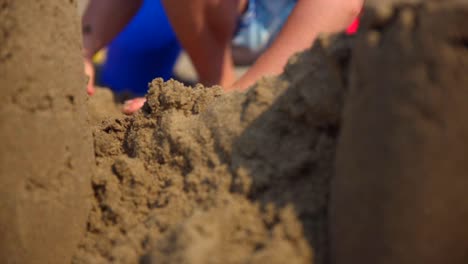 Child-building-sandcastle-on-the-beach