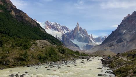 River-valley-in-Patagonia-with-snowy-mountains-in-the-distance