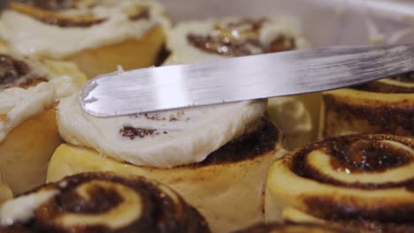 Frosting-Freshly-Baked-Cinnamon-Rolls-With-Cream-Cheese-Icing