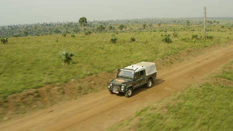 Animal-ambulance-driving-at-speed-along-dirt-road