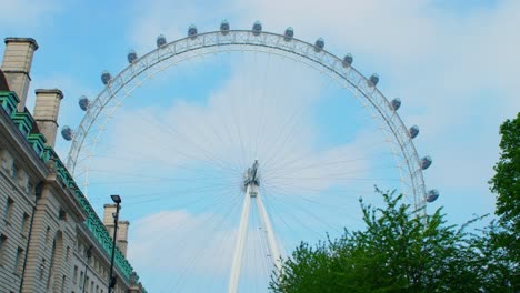 Lockdown-in-London,-the-closed-Millennium-Eye-not-moving-and-static,-during-the-COVID-19-2020-pandemic-with-blue-skies-and-clouds,-shot-on-RED-Scarlet-W-5K