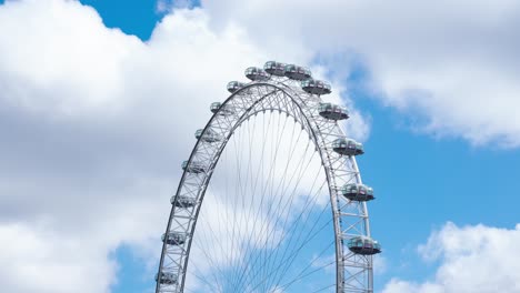 Time-lapse-of-the-static-London-Eye-not-turning-with-clouds-on-a-sunny-summer's-day,-during-the-COVID-19-lockdown-pandemic-2020