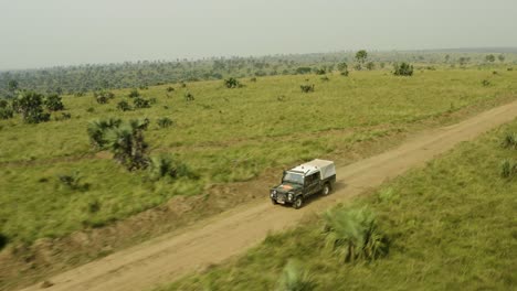 Ambulance-rushes-to-scene-in-Africa-along-a-dirt-road-in-vast-savannah