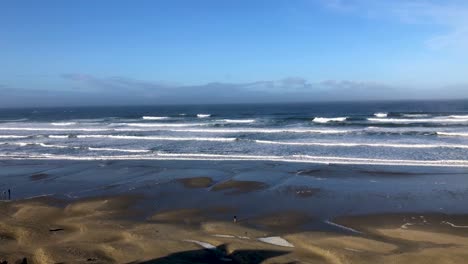 High-tide-with-sand-dunes-below-in-Nye-Beach-Newport-Oregon