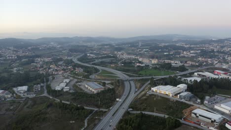 Aerial-tilt-up-shot-of-a-highway-in-a-city-of-Portugal