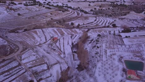 drone-panning-up-from-snowy-mountains-in-spain-with-snow