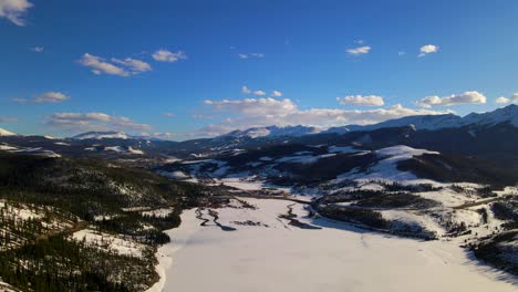 Panning-aerial-shot-of-winter-landscape-in-Rocky-Mountains