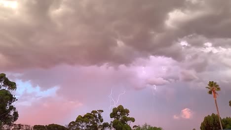 Multiple-strikes-of-lightning-at-sunset,-240-fps