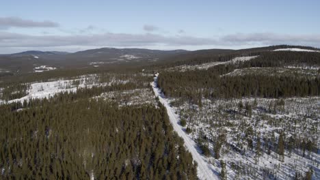 Aerial-view-sideway-drone-shot-winter-landscape-in-the-northern-parts-of-Sweden