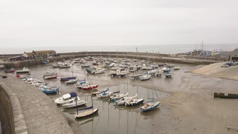 A-low-level-aerial-view-of-Lyme-Regis-harbour-area