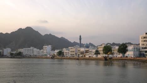 Mutrah-corniche-during-sunrise-with-seagulls-flying-and-calm-weather