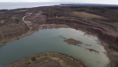 Slow-bird-view-Aerial-view-drone-flight-over-lake-in-Kinnekulle-Sweden
