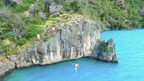 AERIAL---Diving-into-the-turquoise-waters-of-General-Carrera-Lake,-Chile