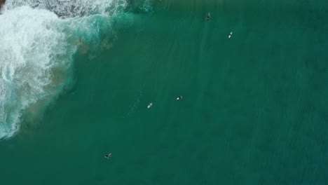 Birdseye-view-drone-shot-over-a-local-point-break-in-Tofo,-Mozambique