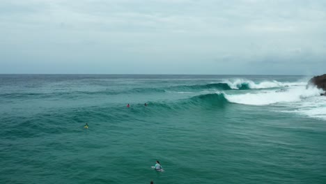 Drone-shot-of-surfers-waiting-in-the-lineup-for-a-wave---Tofo,-Mozambique