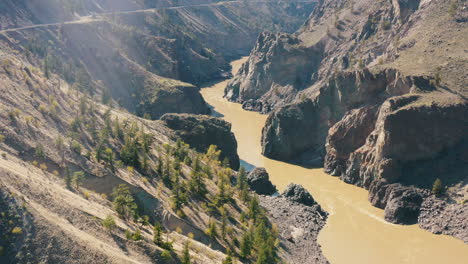 Aerial-slide-out-over-dramatic-river-gorge-landscape