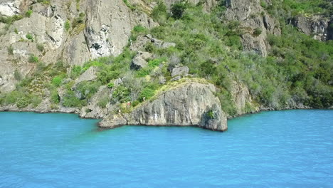 AERIAL---Turquoise-waters-of-General-Carrera-Lake,-Patagonia,-Chile,-wide-shot