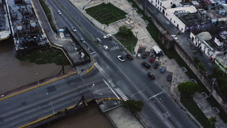 AERIAL---Intersection-in-the-docks-of-Santo-Domingo,-Dominican-Republic,-circle-pan