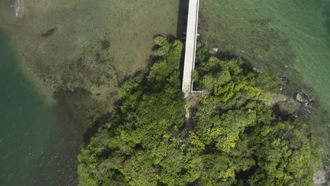 AERIAL---Bridge-of-the-islands-of-Samana,-Dominican-Republic,-top-down-tilt-up-reveal