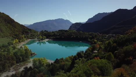 Mountain-blue-water-lake-in-Italian-Alps-Dolomites-with-trees-and-peaks-drone-aerial