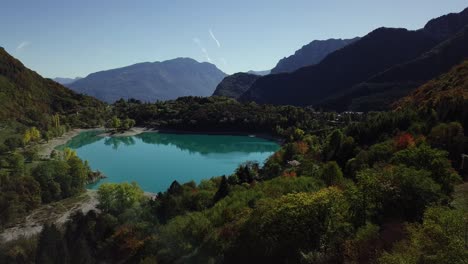 Mountain-blue-water-lake-in-Italian-Alps-Dolomites-with-trees-and-peaks-drone-aerial