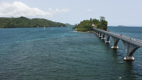 AERIAL---Bridge-between-islands-of-Samana,-Dominican-Republic,-forward-wide-shot