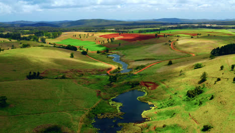 Aerial-View-Of-Marsh-Between-The-Green-Hills-In-Rural-Area-Of-Atherton-In-Australia