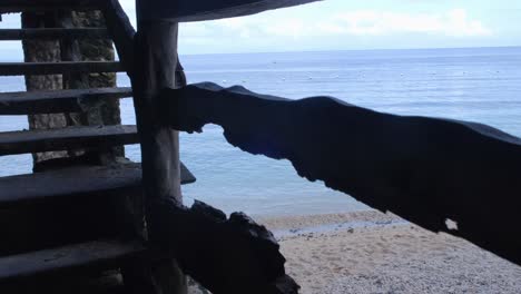 Climbing-To-Wooden-Viewing-Platform-With-Panoramic-Seascape-View-Through-An-Old-Wooden-Staircase-At-Beach-In-Aloguinsan,-Cebu,-Philippines
