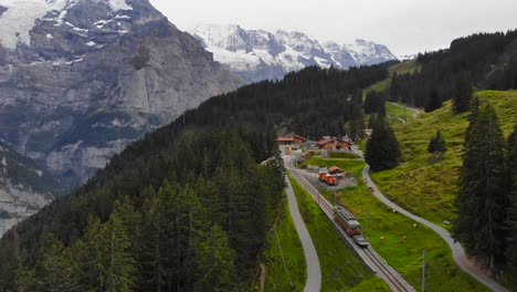 Aerial:-little-mountain-train-in-the-Jungfraujoch-region-6