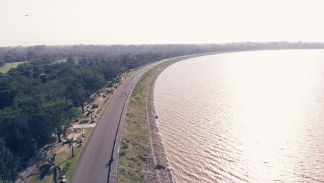 Aerial-view-of-the-curvy-pedestrian-lane-on-a-windy-day-of-Sukhana-Lake-in-Chandigarh