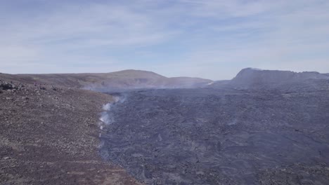 Field-of-Lava-in-the-active-Volcanic-region,-Geldingadalir,-Iceland---aerial-drone-shot