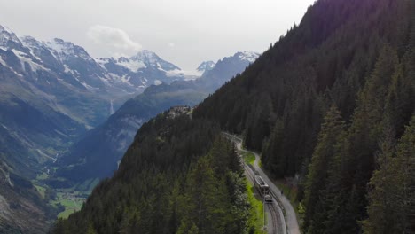 Aerial:-little-mountain-train-in-the-Jungfraujoch-region-4