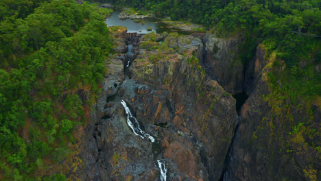 Scenic-Waterfalls-In-The-Rugged-Landscape-Of-Kuranda,-Queensland,-Australia---aerial-drone-shot