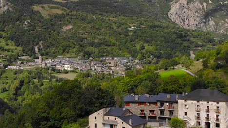 Aerial:-small-town-in-the-mountains-in-spring