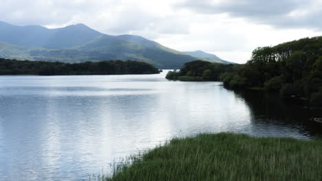 AERIAL---Mountains-in-Killarney-National-Park,-Muckross-Lake-reflection,-Ireland