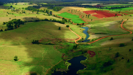 Colorful-Fields-And-Creeks-In-Atherton-Tablelands,-Queensland,-Australia---aerial-drone-shot