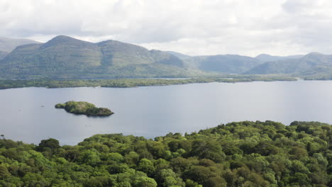 AERIAL---Mountains-in-Killarney-National-Park-and-Muckross-Lake,-Ireland,-truck-left